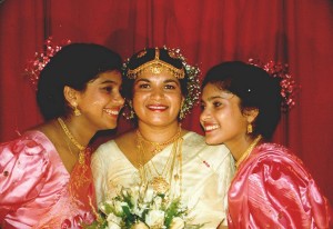 The bride posing with two of her sisters perhaps